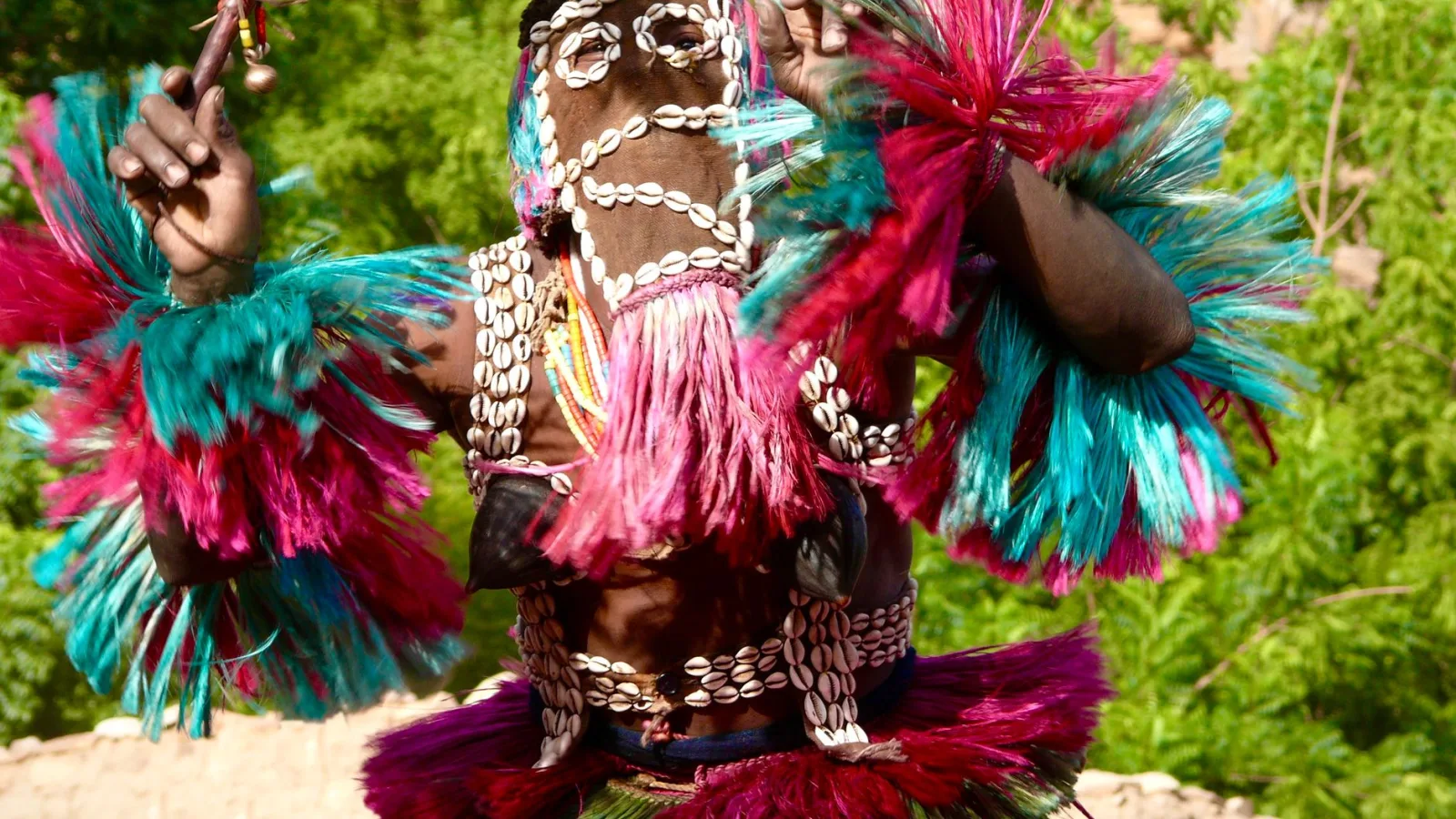 Vibrant traditional dance performed in colorful attire during Malian celebration.
